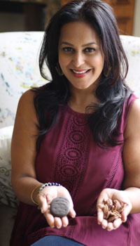 Dr. Shivani Gupta showcasing Ayurvedic tools in her hands.