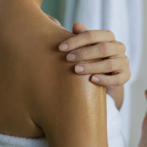 Nourishing skin with oil as part of an Ayurvedic face washing routine.