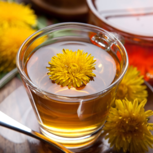 Dandelion tea in a glass teapot for liver detoxification.