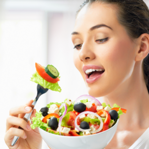 Woman enjoying a healthy salad after completing her morning routine including tongue scraping