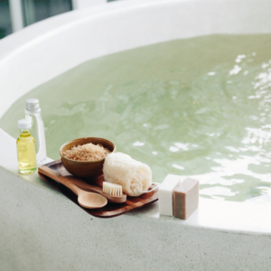 Relaxing bath with natural skincare products and essential oils.