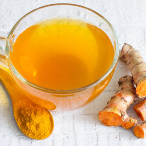 Herbal tea with turmeric, ginger, and spices for digestion.