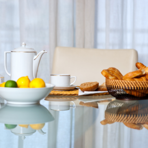Ayurvedic breakfast with fruit, bread, and herbal tea on a table
