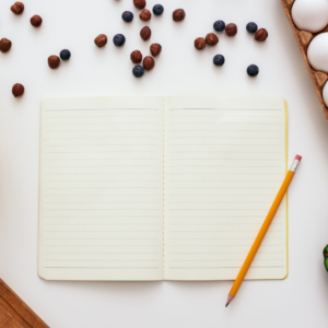 Journal and meal planning for a healthy morning routine.