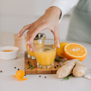 Morning elixir with orange juice and ginger for digestion – Ayurvedic Diet.