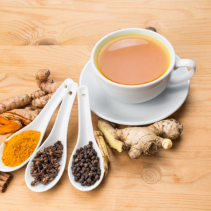 Turmeric tea with ginger, black pepper and roots.