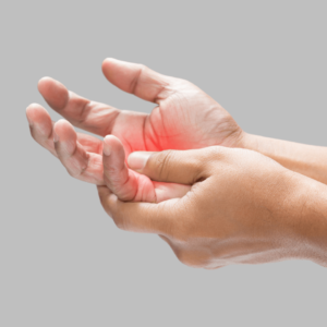 Close-up of inflamed hands experiencing joint pain caused by chronic inflammation.