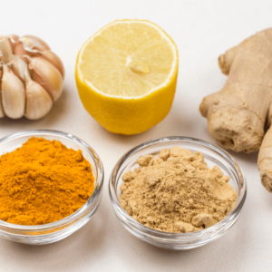 Ayurvedic anti-inflammatory spices, including turmeric, ginger, garlic, and lemon, used for reducing inflammation naturally.