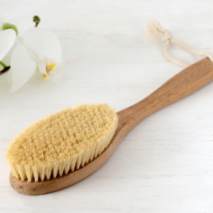  Wooden dry brush used in Ayurvedic self-care for lymphatic drainage and detox.