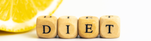 A diet concept with wooden letter blocks spelling "DIET".