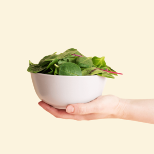 A bowl of leafy greens, essential for Ayurvedic diet