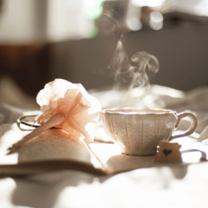 A warm cup of herbal tea with journal