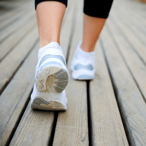  A person walking outdoors in the morning, reflecting on Daily Intentions for a balanced start.