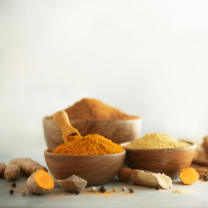 Turmeric superfood for inflammation with fresh turmeric roots and powder