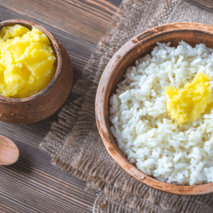 Ayurvedic ghee served over rice to aid digestion and enhance nutrient absorption