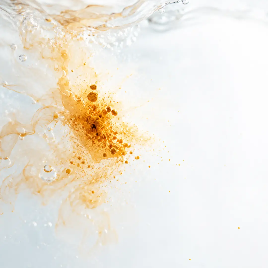 Curcumin particles poorly absorbed in a water-based environment, illustrating low bioavailability