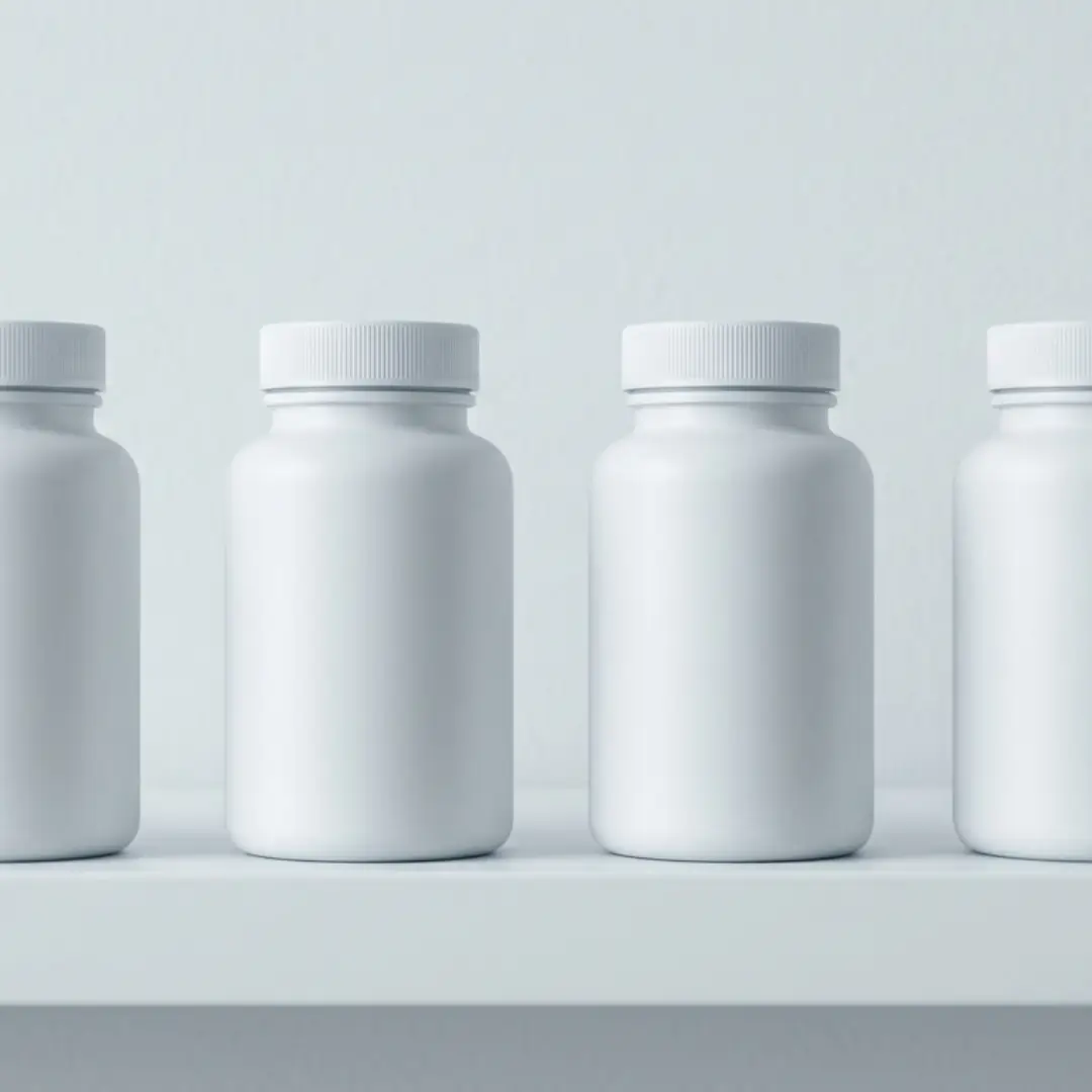 Row of generic supplement bottles representing undifferentiated turmeric products